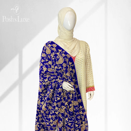 A White Mannequin Wearing a Royal Blue Fancy Velvet Shawl With Heavy Golden Paisley Embroidery, Available to Shop Online at PoshnLuxe.com